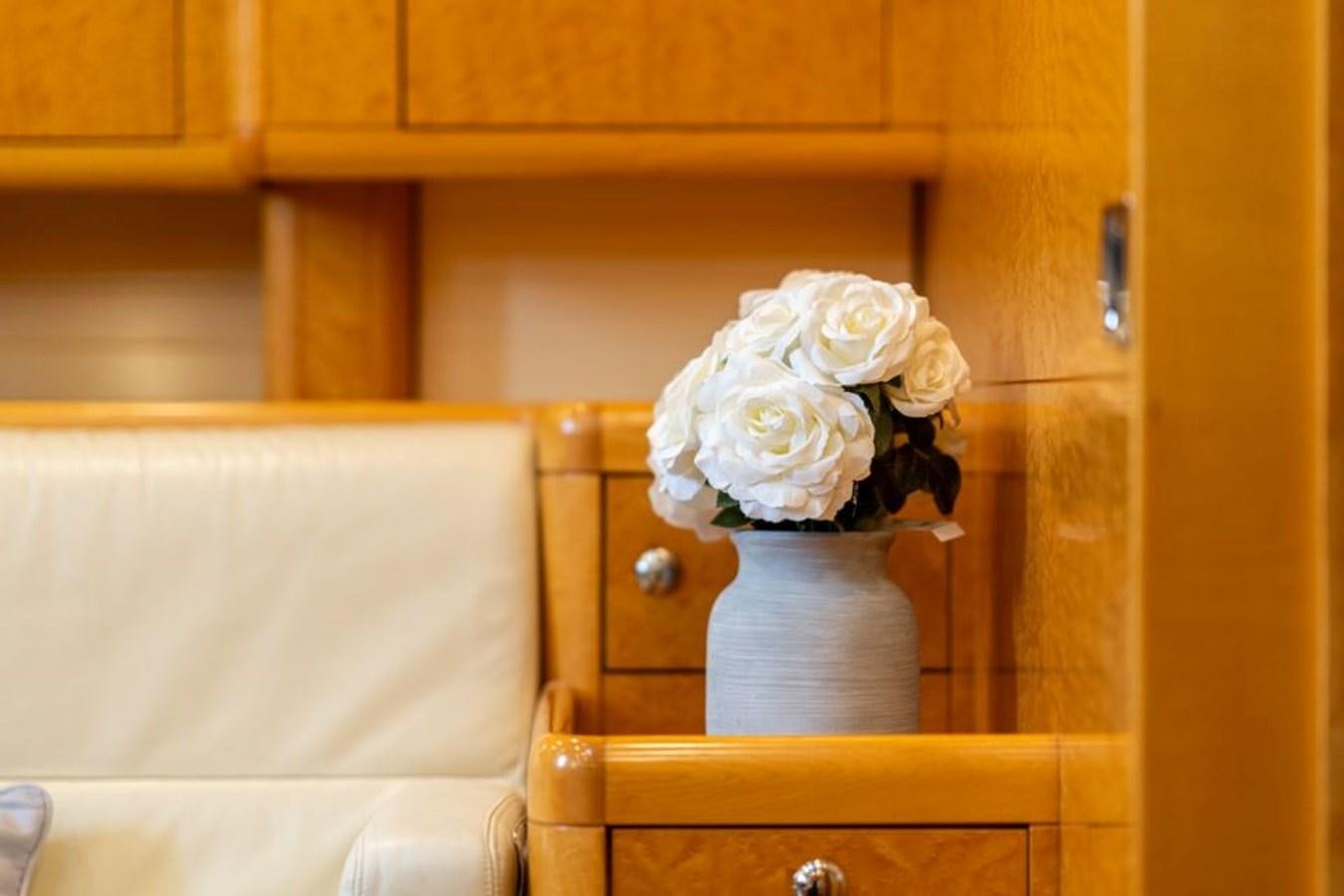 a vase of white flowers aboard ECOVER OF SKAGEN Yacht for Sale