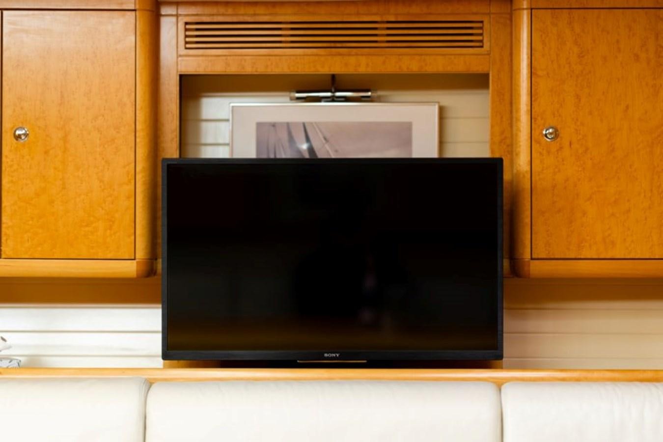 a tv on a shelf aboard ECOVER OF SKAGEN Yacht for Sale
