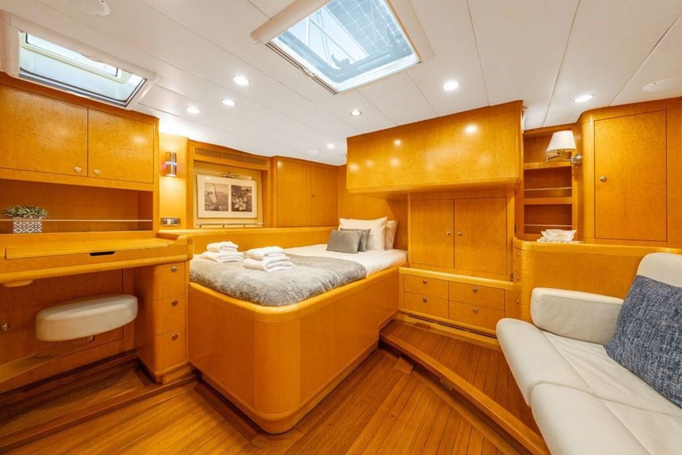 a room with a bed and a couch aboard ECOVER OF SKAGEN Yacht for Sale