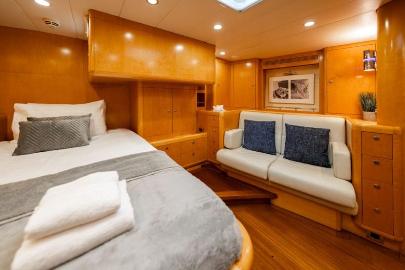 a room with a bed and a couch aboard ECOVER OF SKAGEN Yacht for Sale