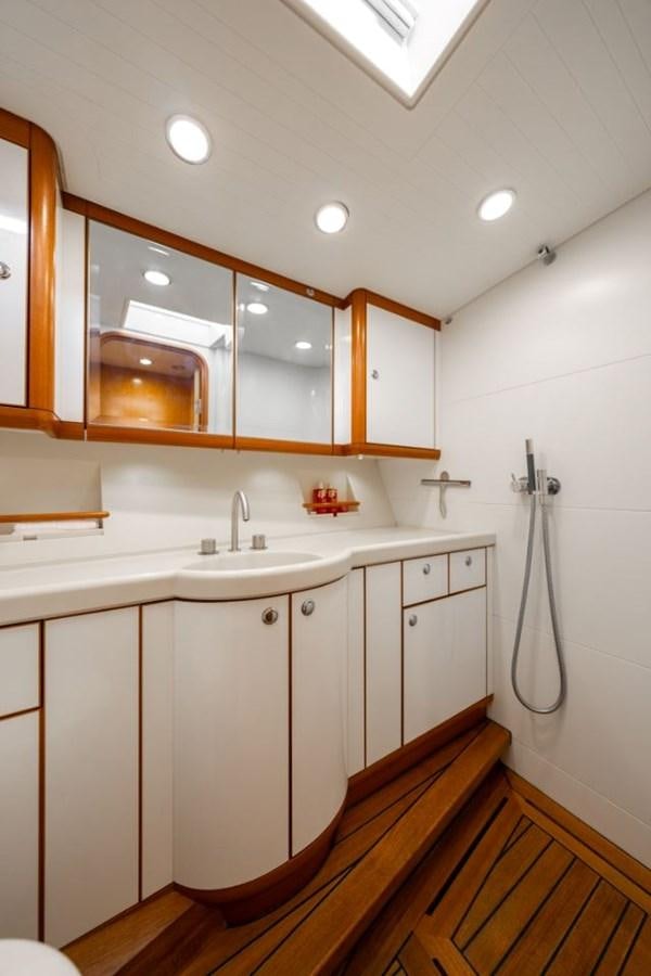 a bathroom with a sink and a mirror aboard ECOVER OF SKAGEN Yacht for Sale