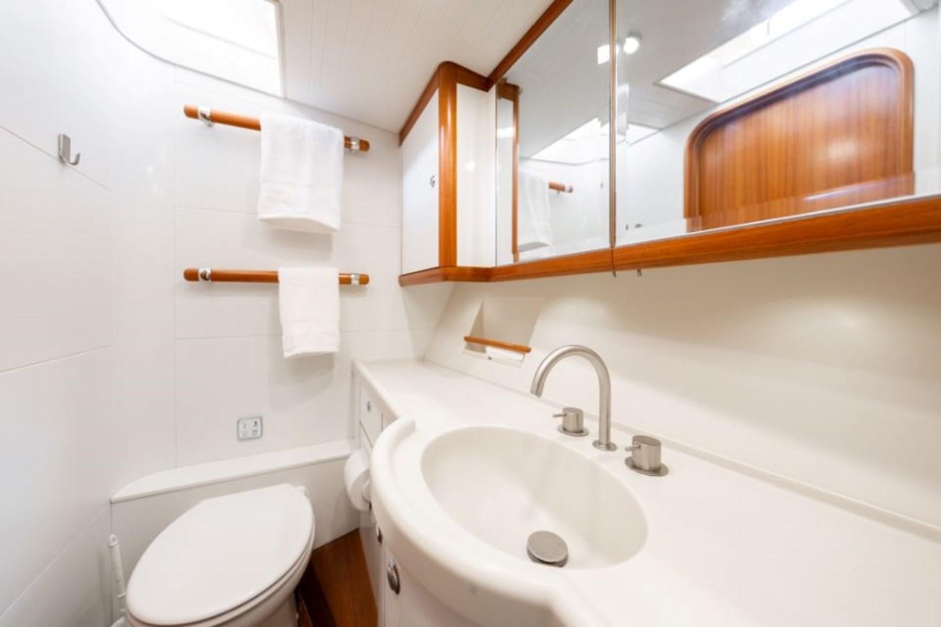a bathroom with a toilet and a sink aboard ECOVER OF SKAGEN Yacht for Sale