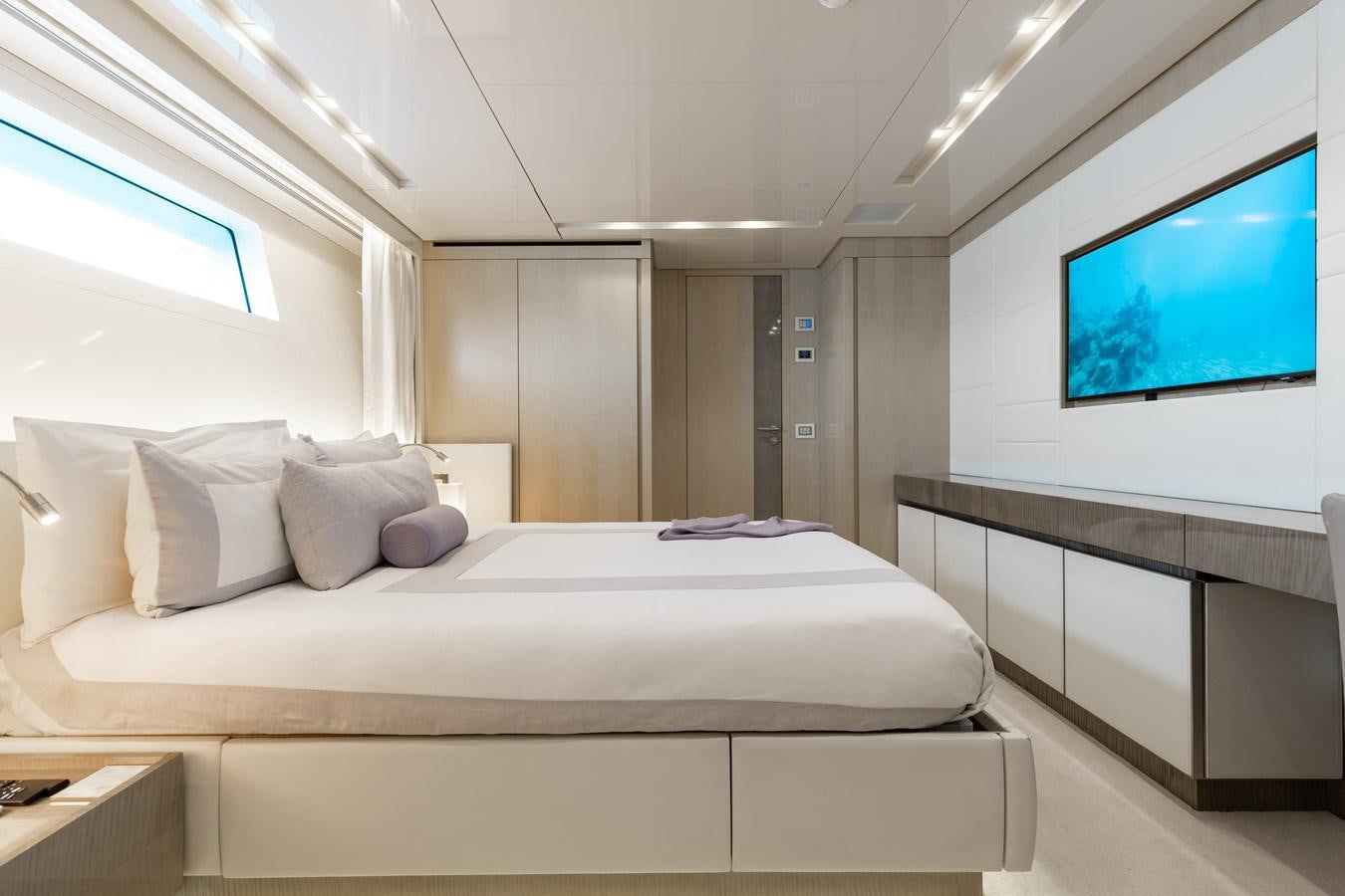 a bed in a room aboard TAKARA ONE Yacht for Sale