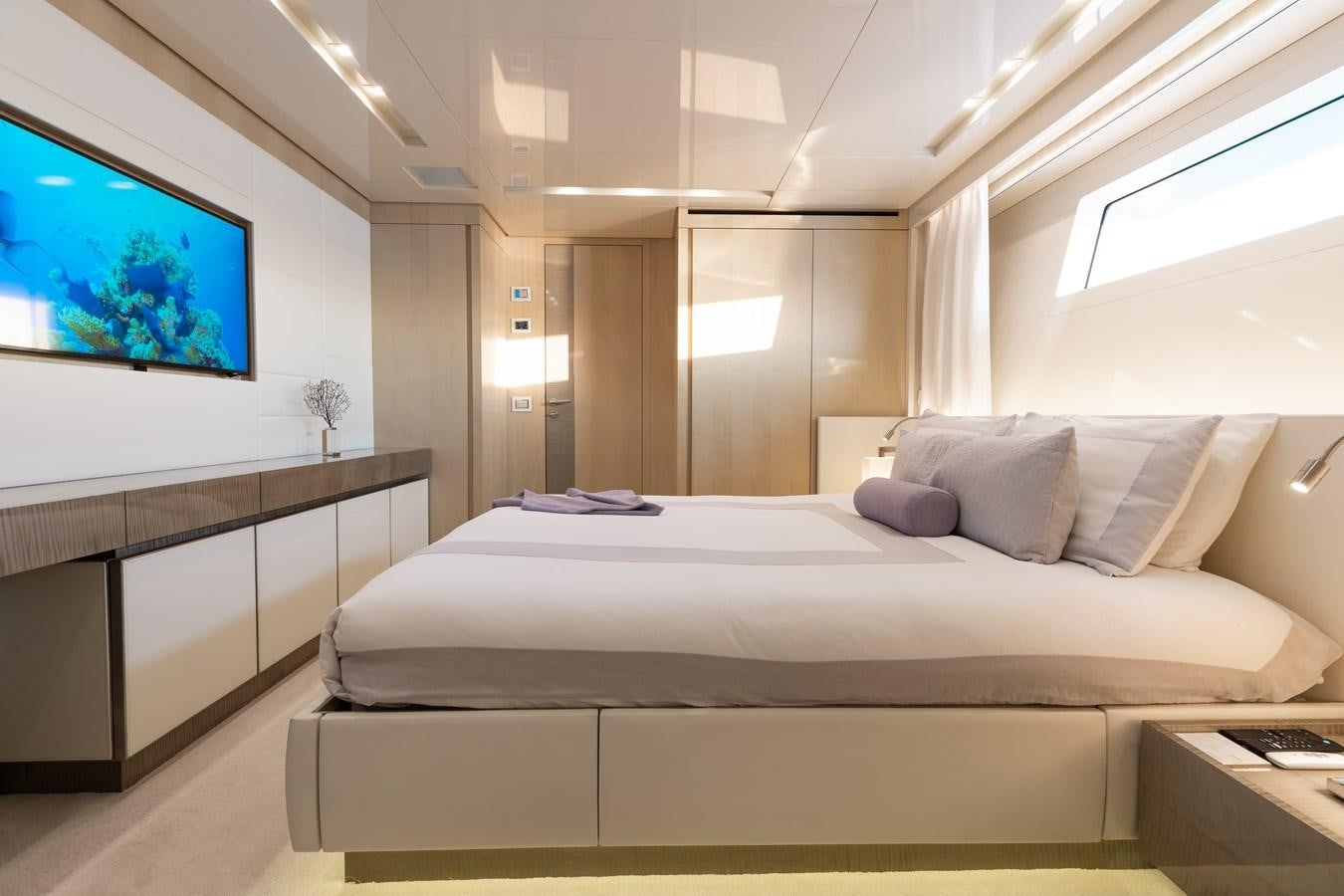 a bed in a room aboard TAKARA ONE Yacht for Sale