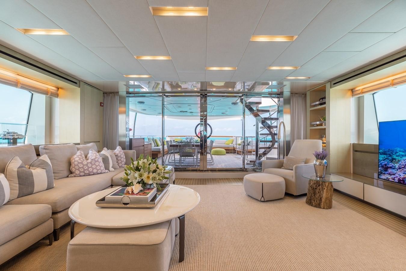 a living room with a large glass window aboard TAKARA ONE Yacht for Sale