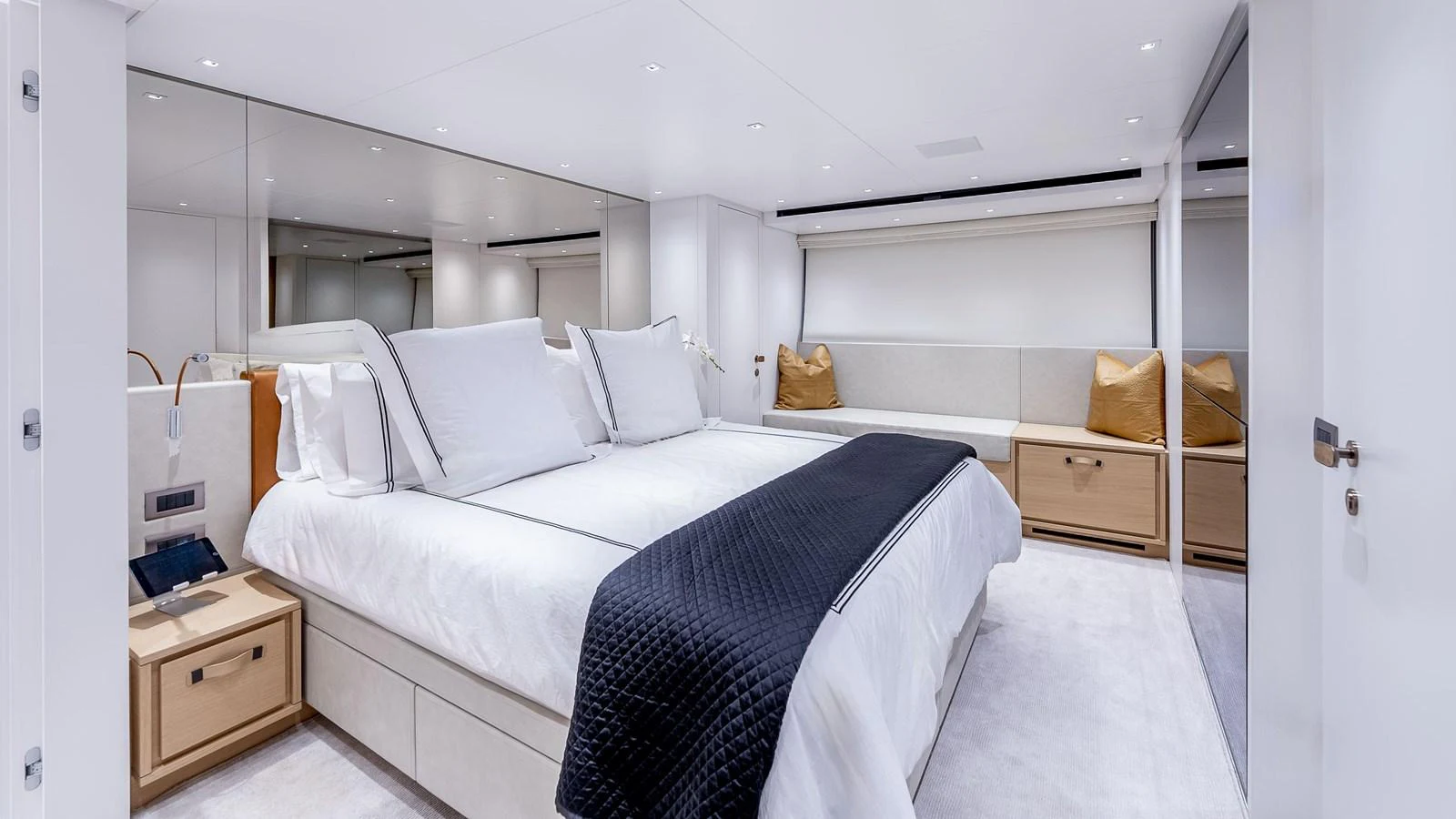 a room with a bed and a desk aboard GATSBY Yacht for Sale
