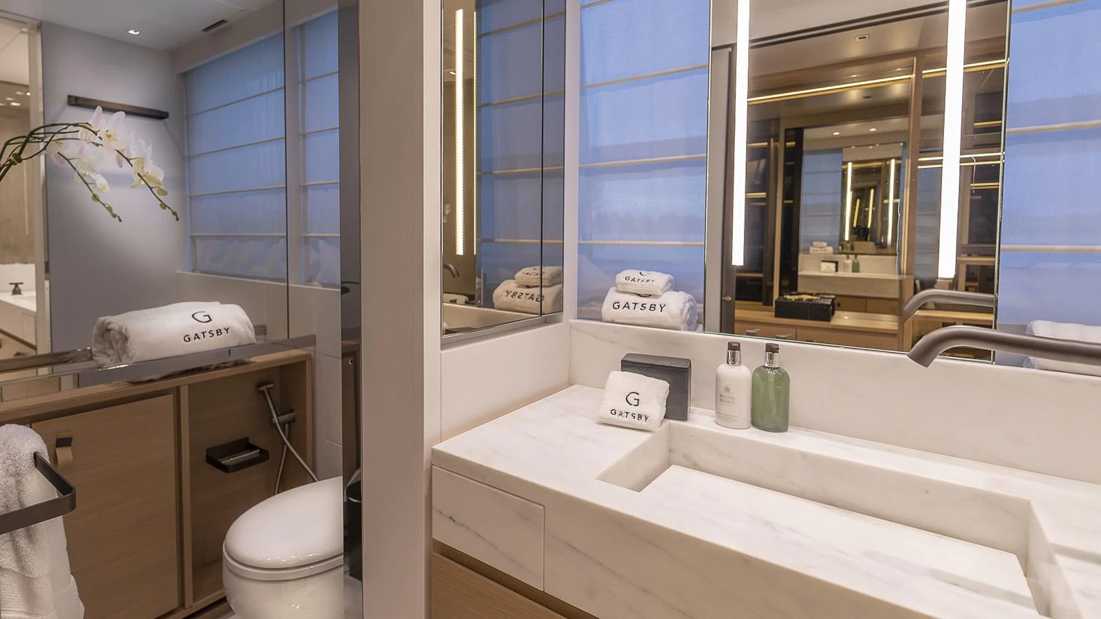 a bathroom with a large mirror aboard GATSBY Yacht for Sale