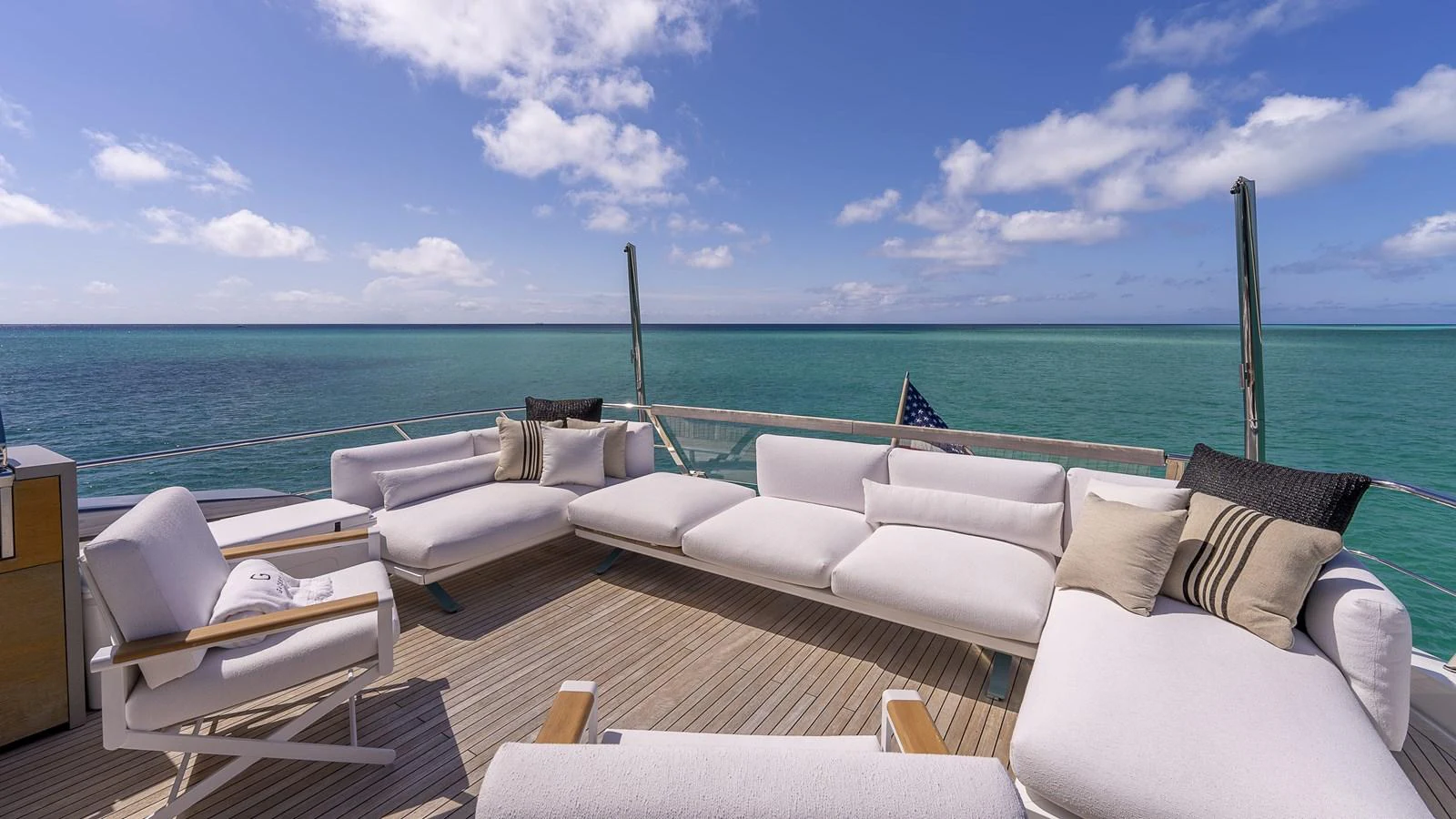 a room with a view of the ocean and a beach aboard GATSBY Yacht for Sale