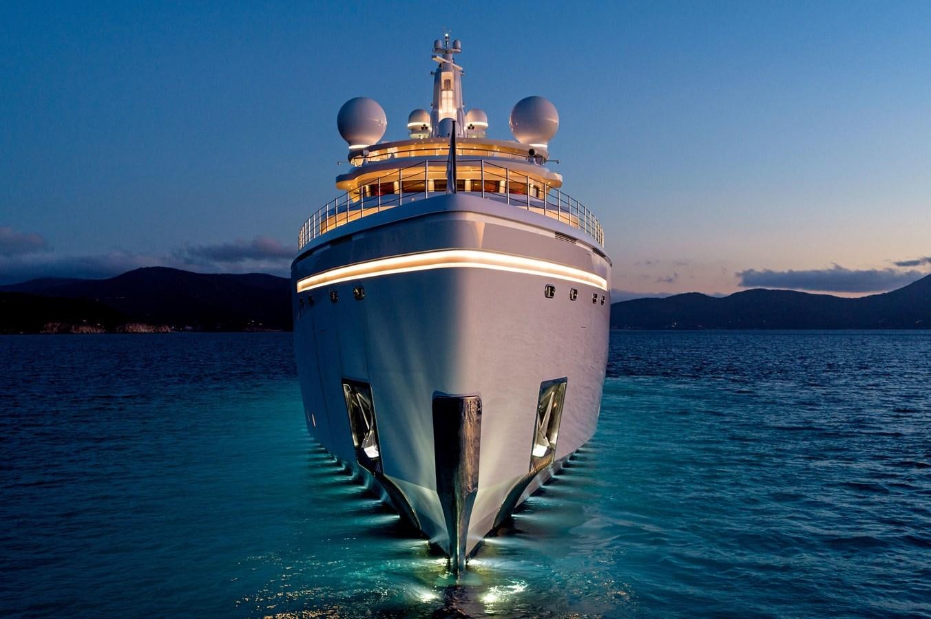 a large white ship in the water aboard LUMINOSITY Yacht for Sale