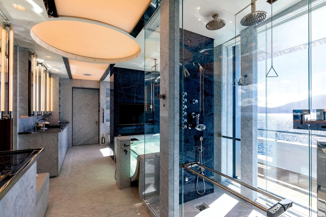 a large room with glass walls aboard LUMINOSITY Yacht for Sale