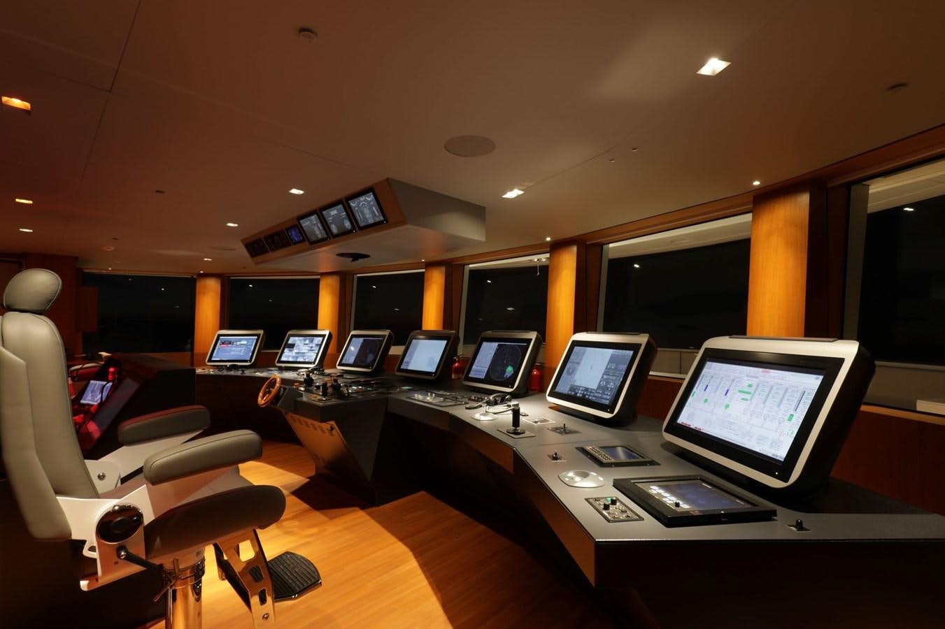 a room with computers and monitors aboard LUMINOSITY Yacht for Sale