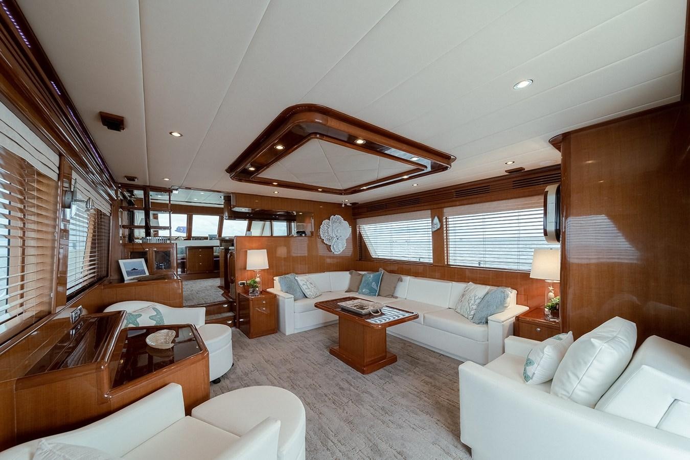 a living room with a large window aboard ISOBEL III Yacht for Sale