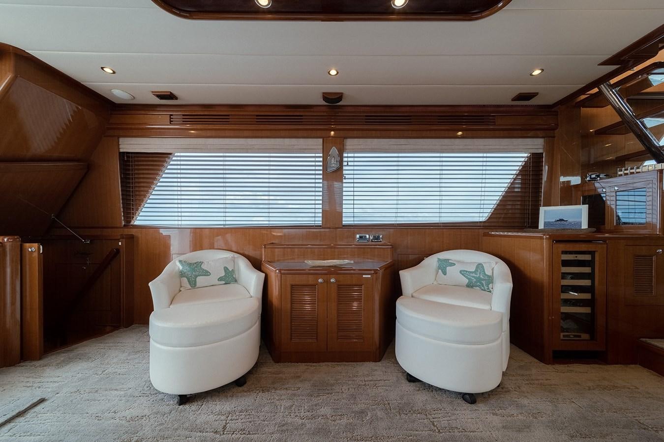 a room with a chair and a couch aboard ISOBEL III Yacht for Sale