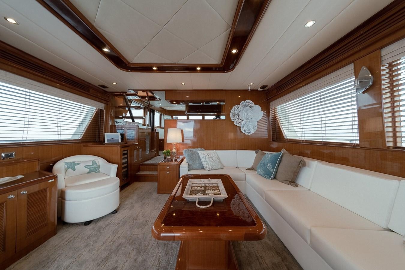 a room with a bed and a table aboard ISOBEL III Yacht for Sale
