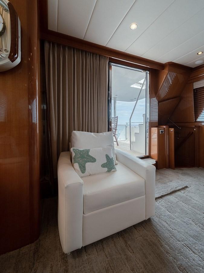 a white chair in a room aboard ISOBEL III Yacht for Sale