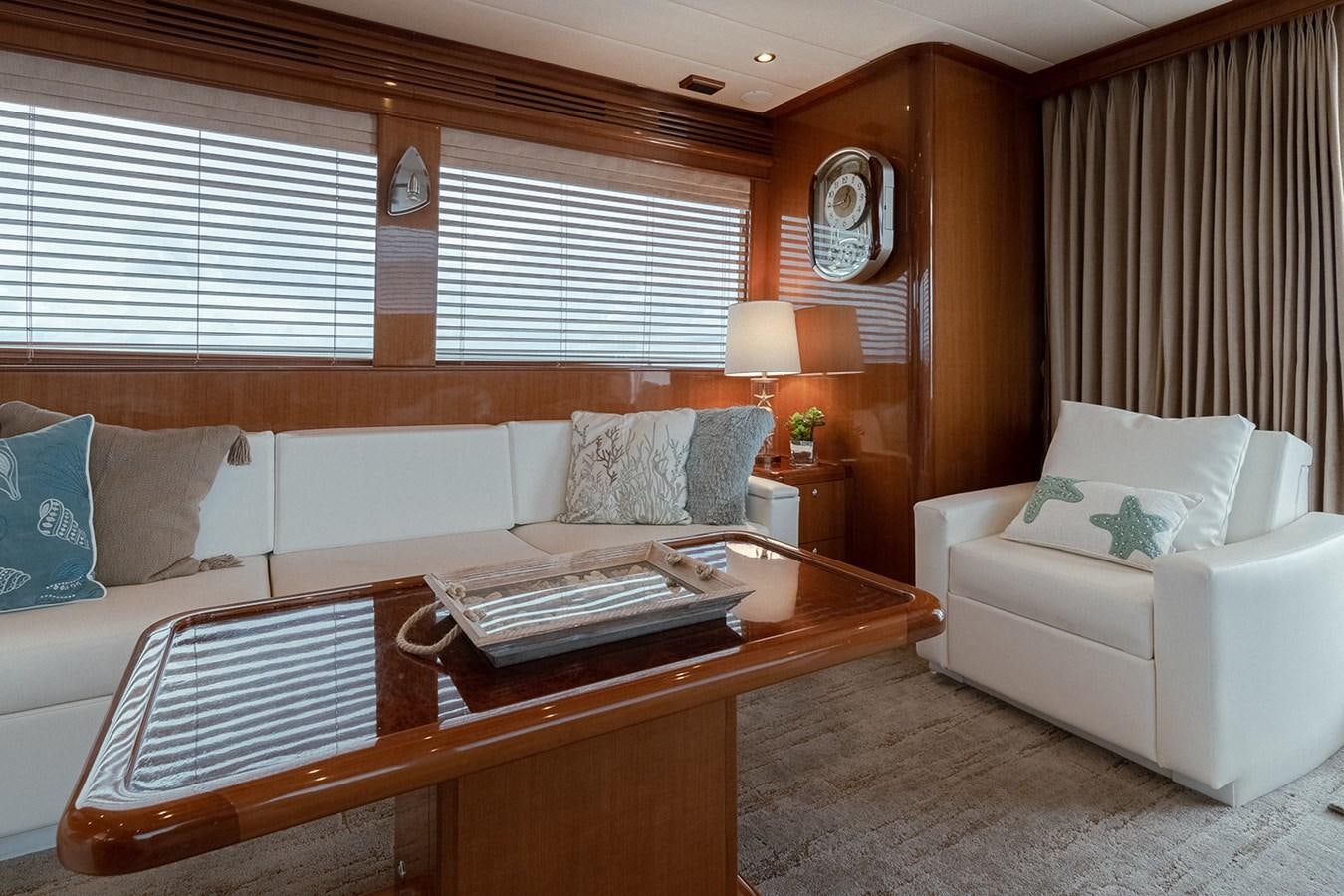 a room with a bed and a table aboard ISOBEL III Yacht for Sale