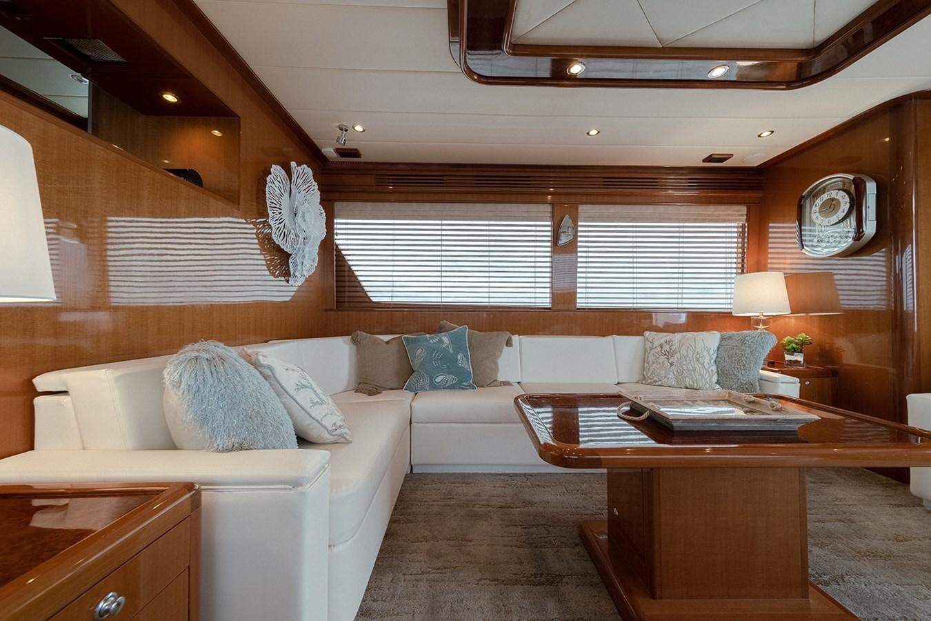 a living room with a couch and a coffee table aboard ISOBEL III Yacht for Sale