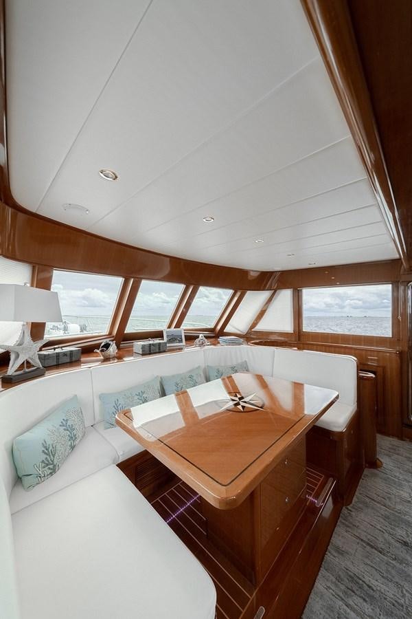 a room with a bed and a table aboard ISOBEL III Yacht for Sale
