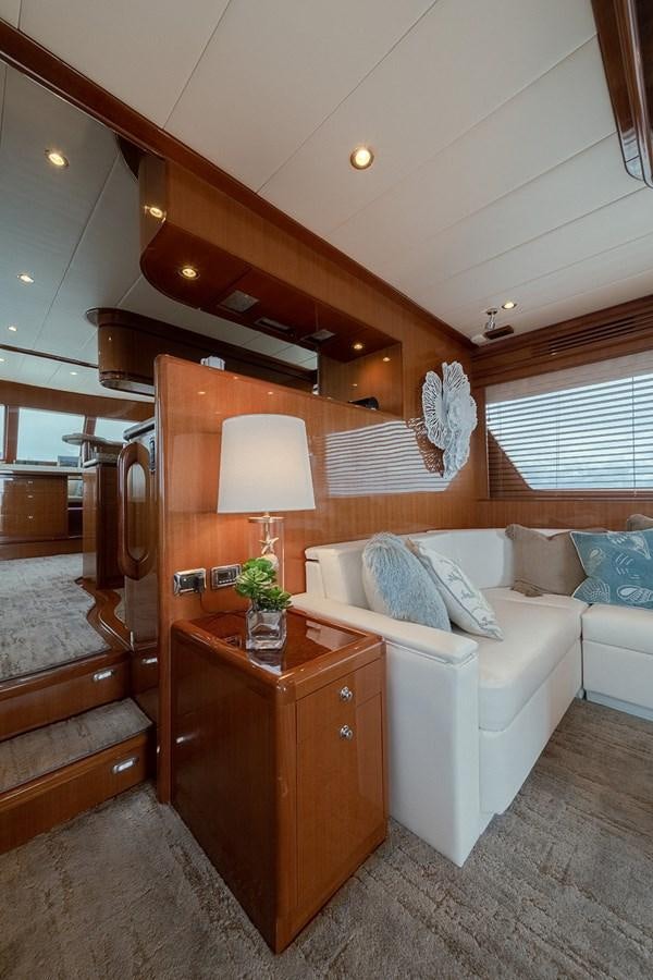 a living room with a couch and a table aboard ISOBEL III Yacht for Sale