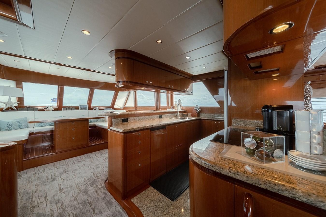 a kitchen with wooden cabinets aboard ISOBEL III Yacht for Sale