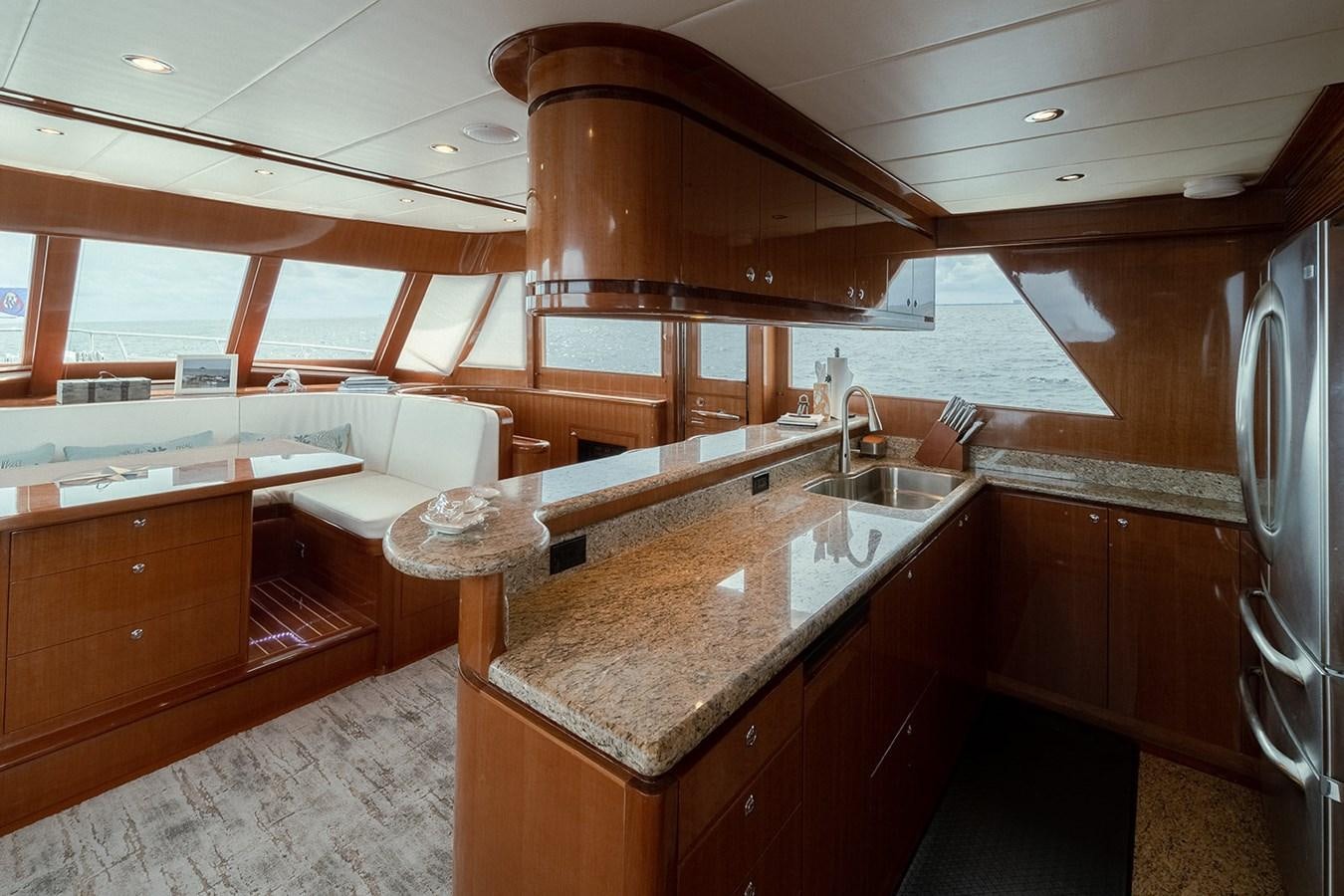 a kitchen with a large island aboard ISOBEL III Yacht for Sale