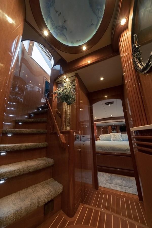 a staircase with a chandelier aboard ISOBEL III Yacht for Sale
