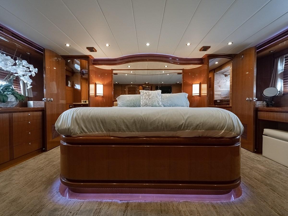 a bed in a room aboard ISOBEL III Yacht for Sale