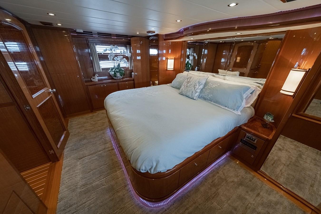 a bed in a room aboard ISOBEL III Yacht for Sale