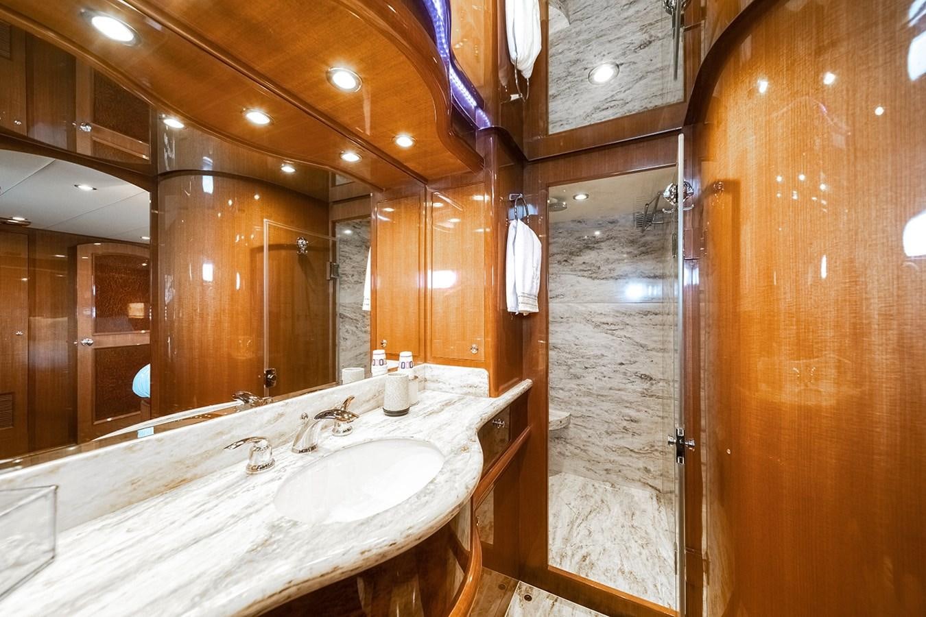 a bathroom with a large mirror aboard ISOBEL III Yacht for Sale