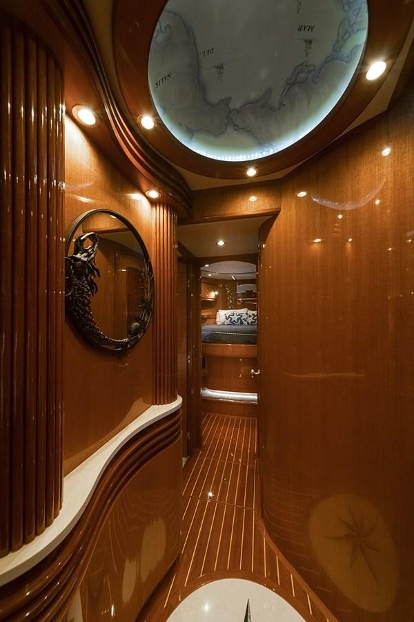 a large clock hangs from the ceiling aboard ISOBEL III Yacht for Sale