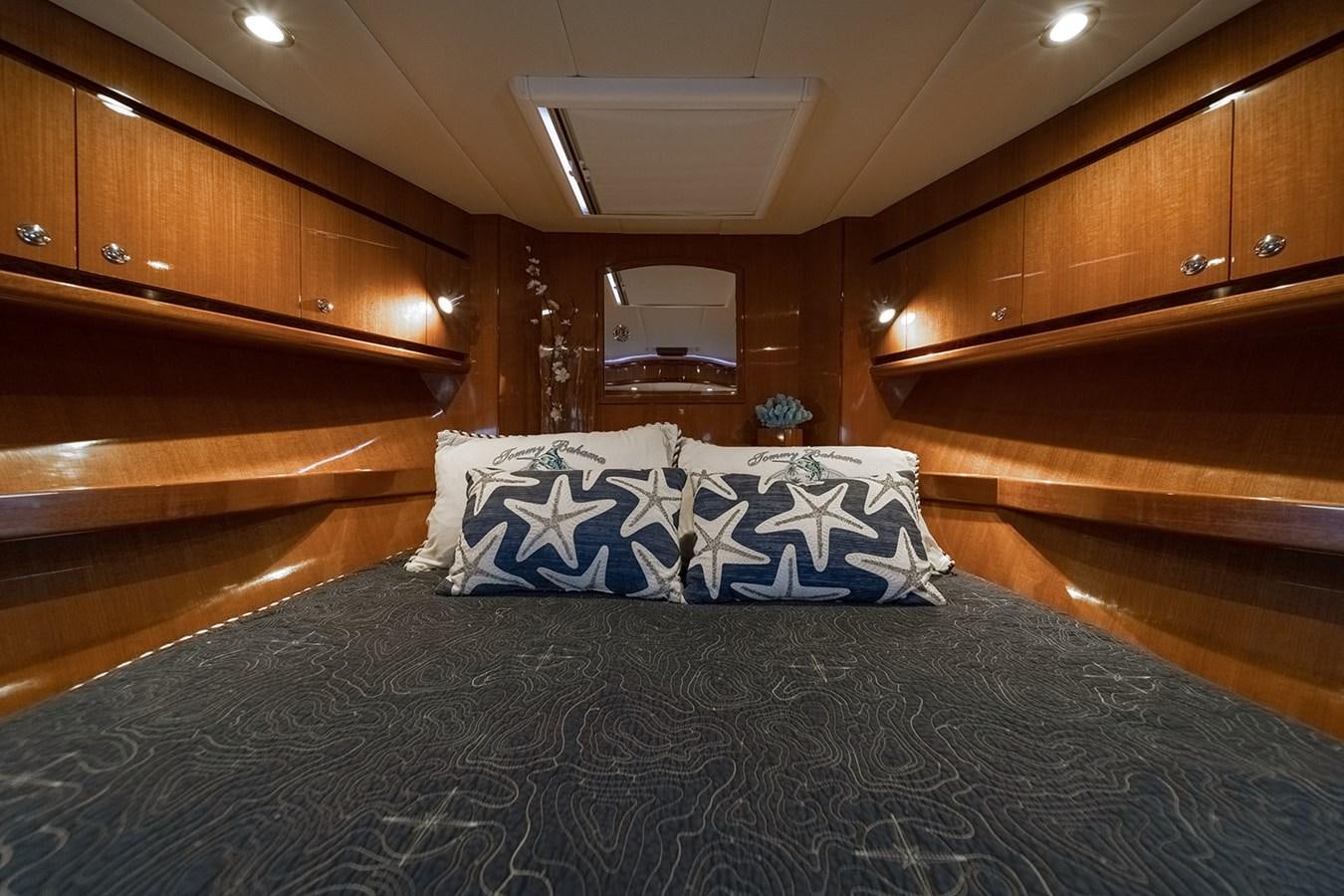a bed in a room aboard ISOBEL III Yacht for Sale