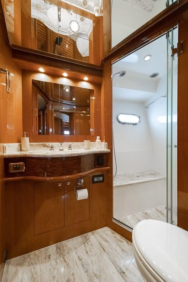 a bathroom with a large mirror aboard ISOBEL III Yacht for Sale