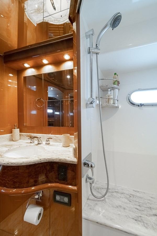 a bathroom with a shower and sink aboard ISOBEL III Yacht for Sale