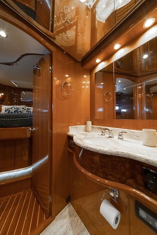 a bathroom with a large mirror aboard ISOBEL III Yacht for Sale
