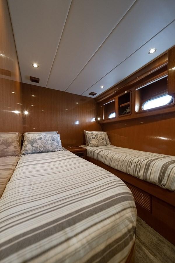 a couple of beds in a room aboard ISOBEL III Yacht for Sale