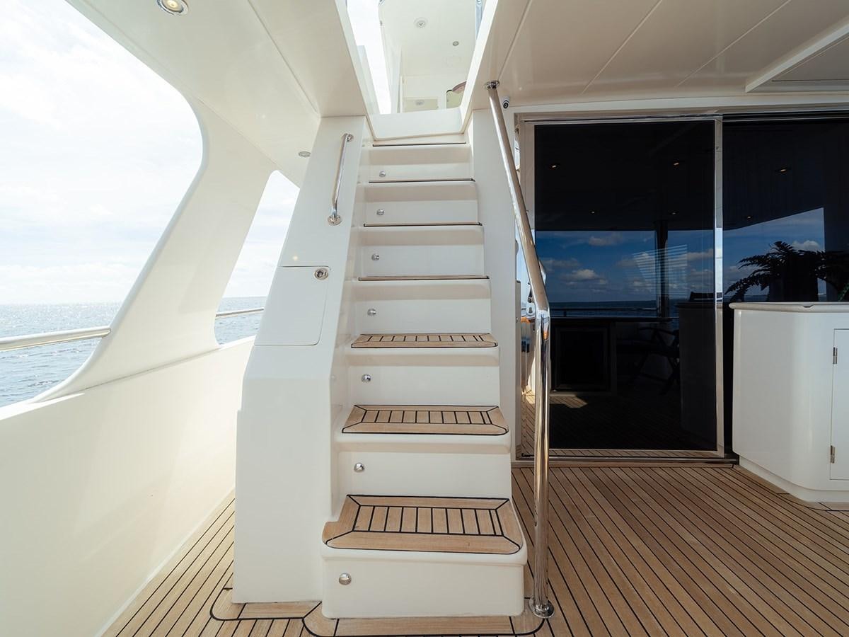 a white staircase in a room aboard ISOBEL III Yacht for Sale