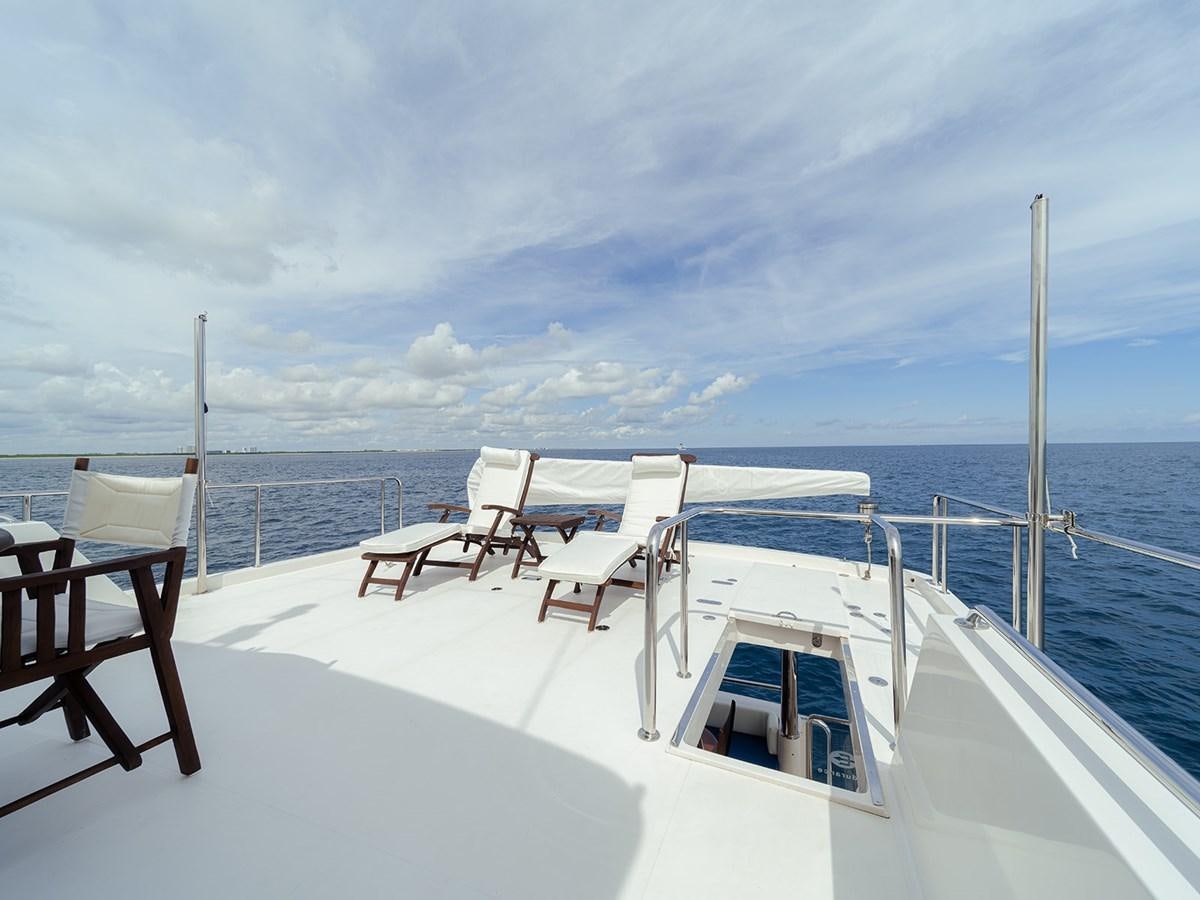a row of chairs on a boat aboard ISOBEL III Yacht for Sale