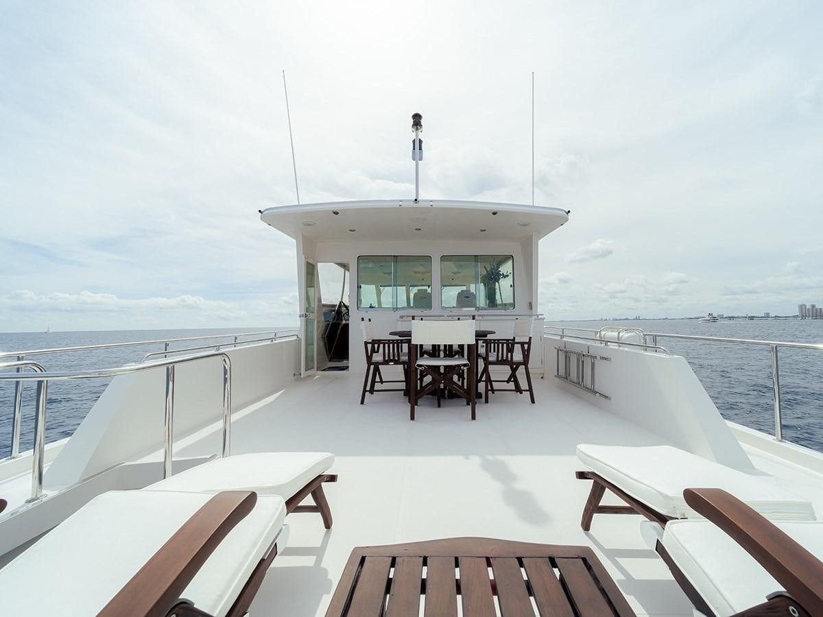 a table and chairs on a boat aboard ISOBEL III Yacht for Sale