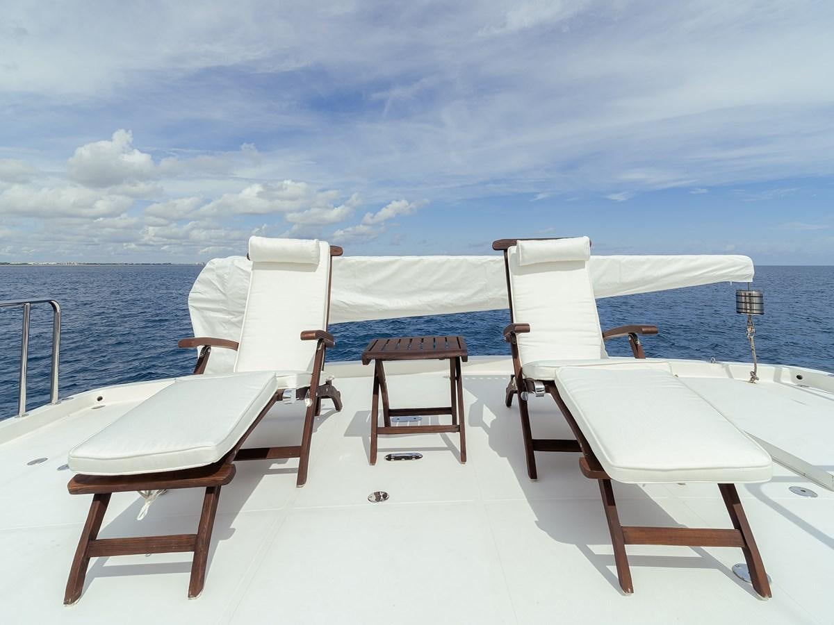 a group of chairs on a boat aboard ISOBEL III Yacht for Sale