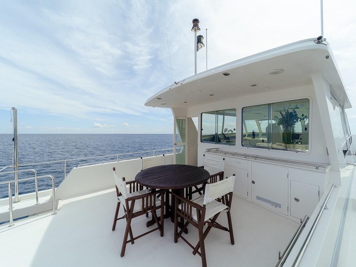 a table and chairs on a boat aboard ISOBEL III Yacht for Sale