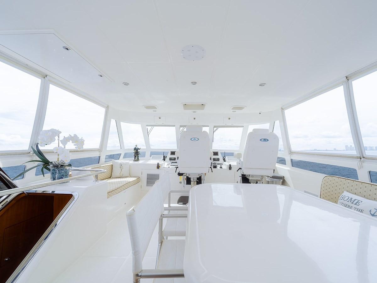 a room with white furniture aboard ISOBEL III Yacht for Sale