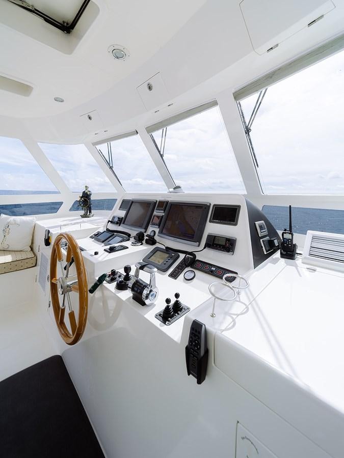 a room with computers and other electronics aboard ISOBEL III Yacht for Sale