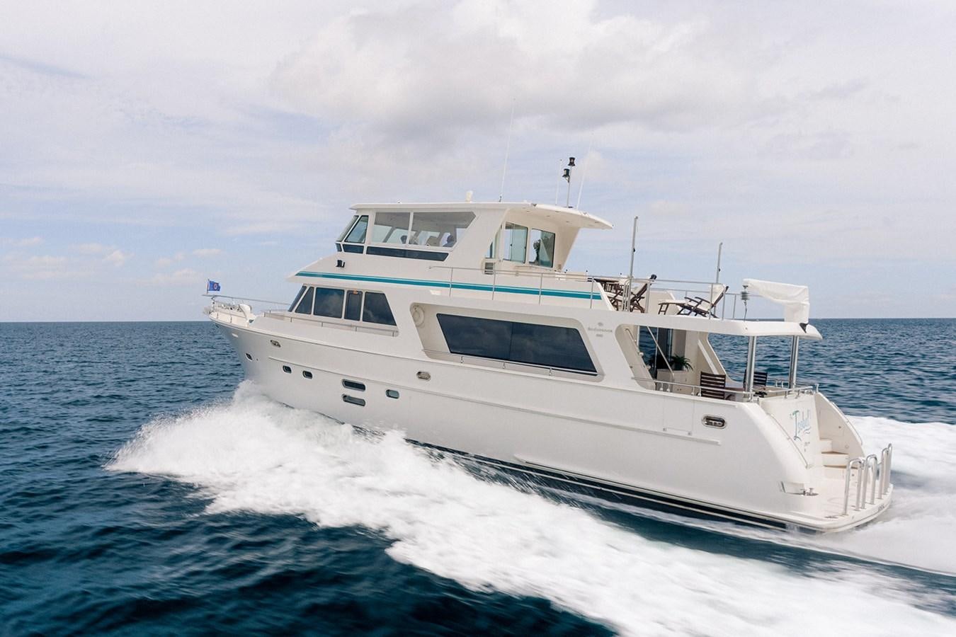 a white boat on the water aboard ISOBEL III Yacht for Sale