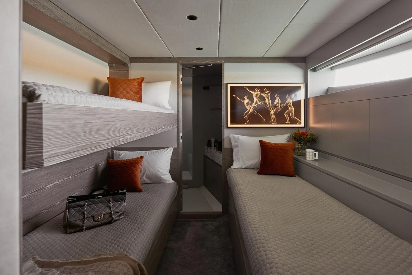 a room with a bed and a couch aboard ASKARI Yacht for Sale