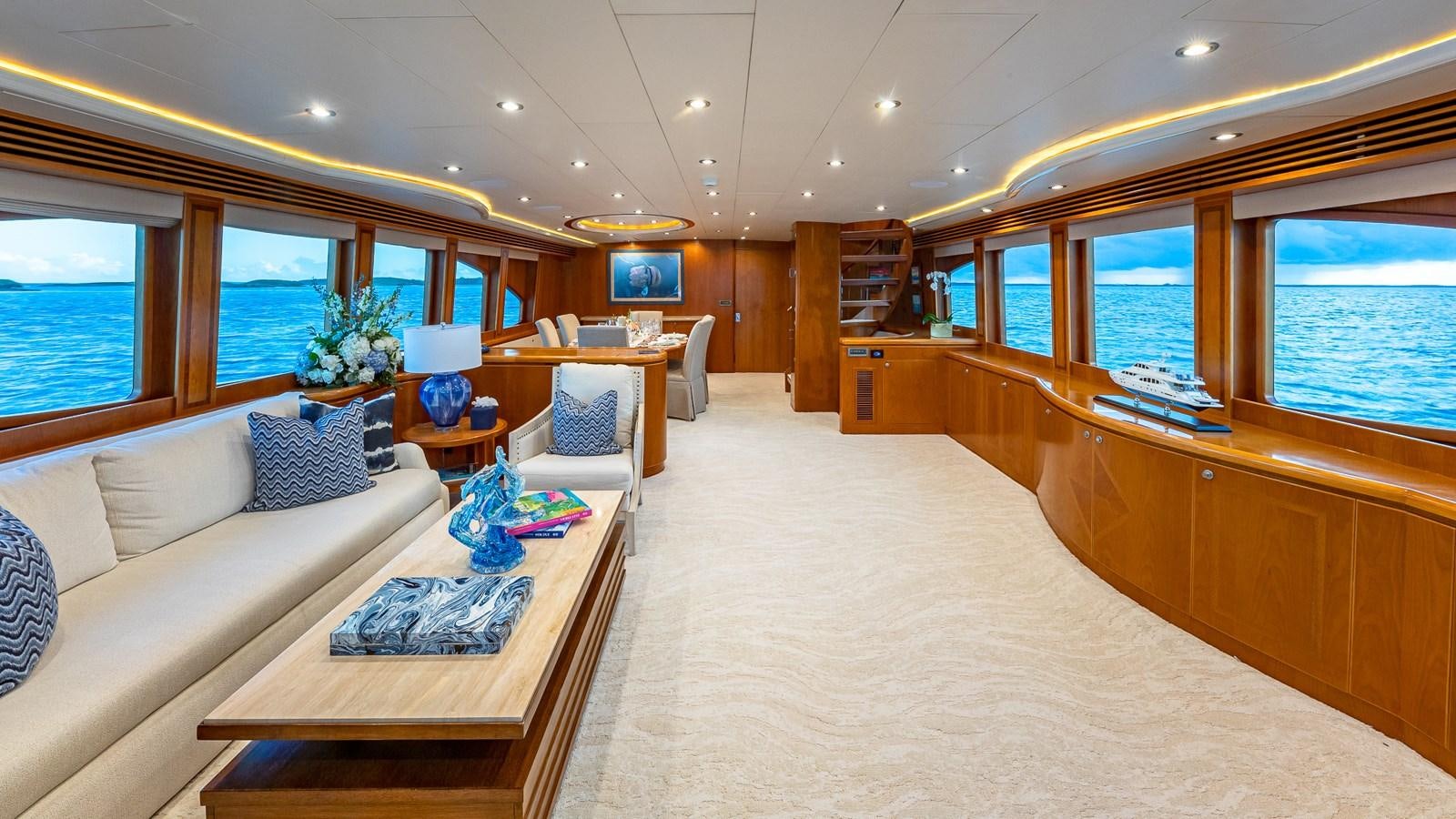 a large living room with a large open window aboard B HAPPY Yacht for Sale