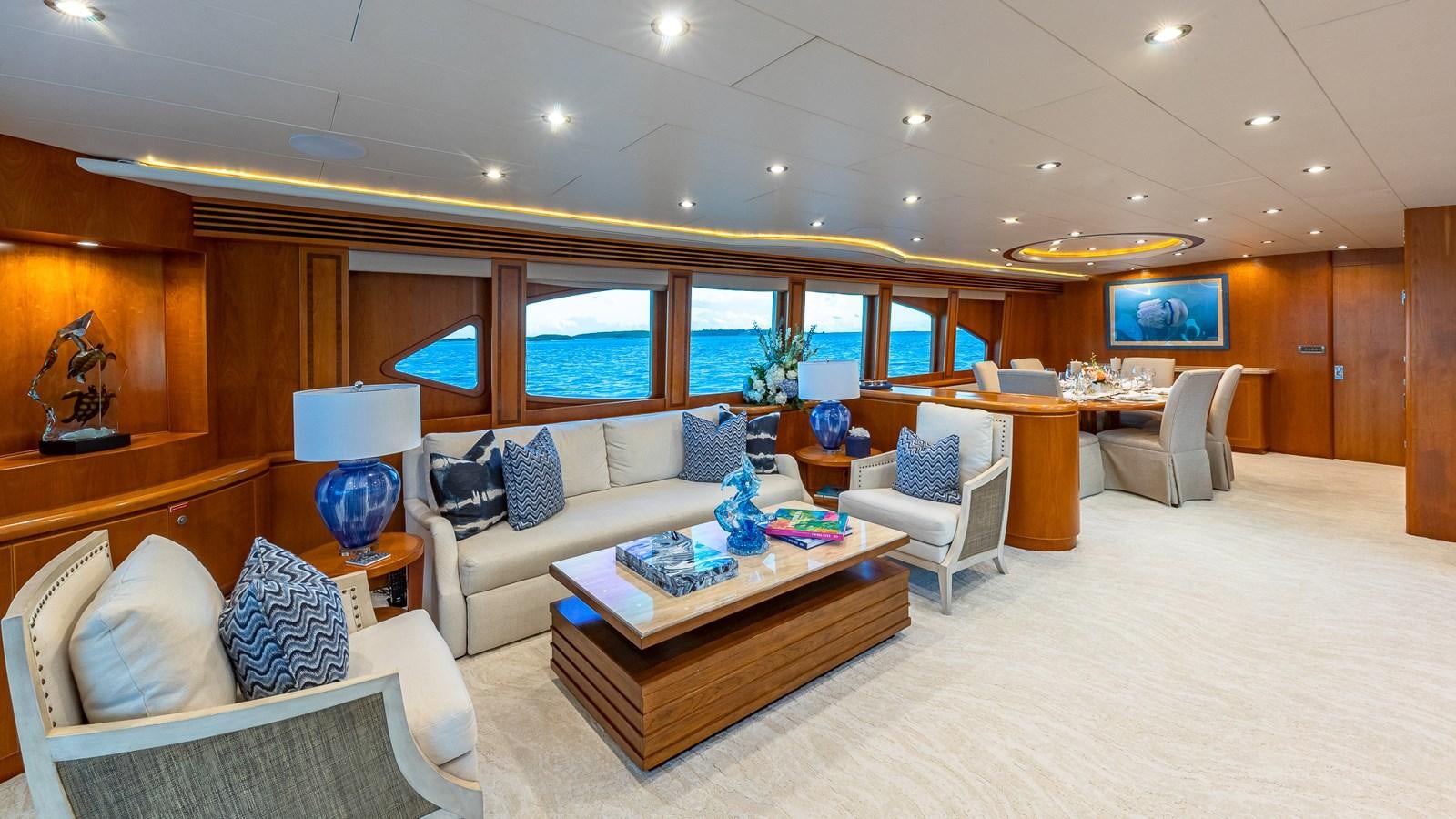 a living room with a couch and a coffee table aboard B HAPPY Yacht for Sale