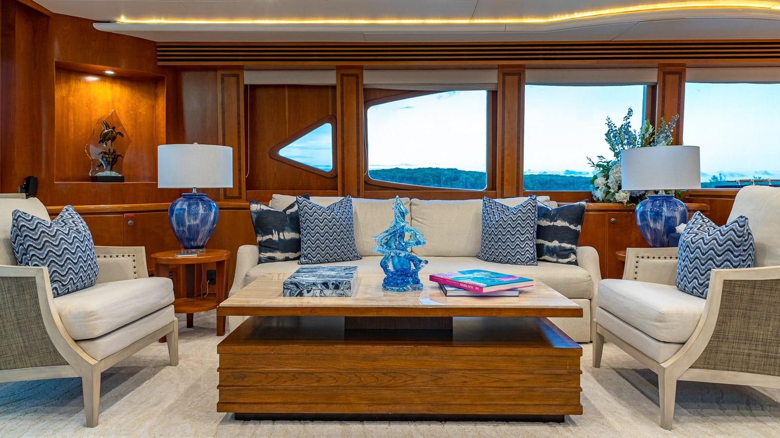 a living room with a couch and a coffee table aboard B HAPPY Yacht for Sale