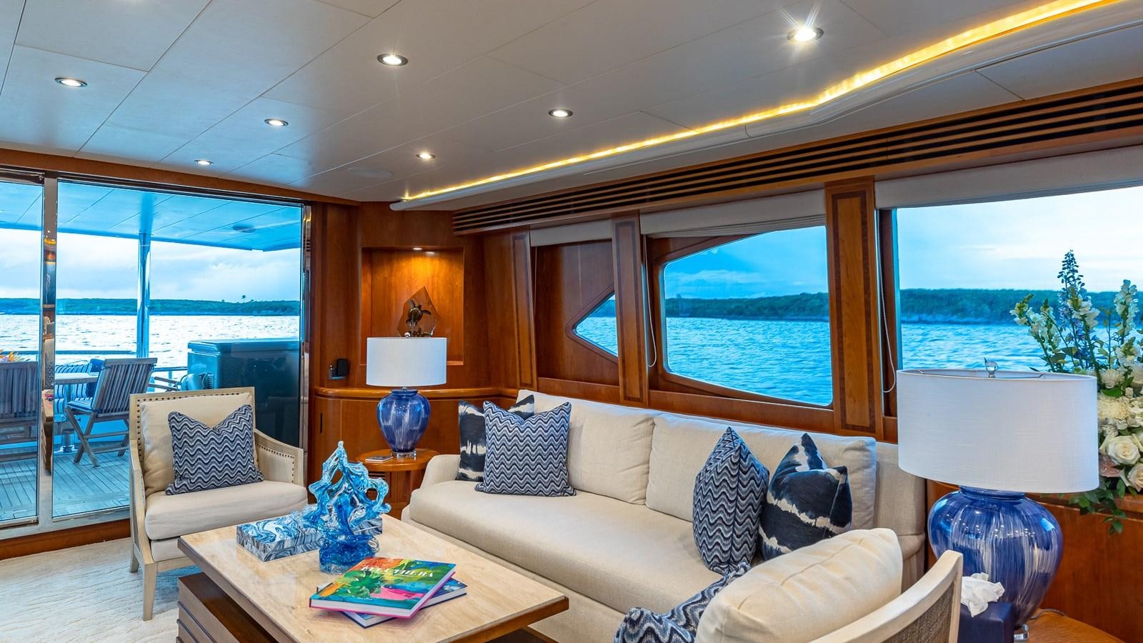 a living room with a large window aboard B HAPPY Yacht for Sale