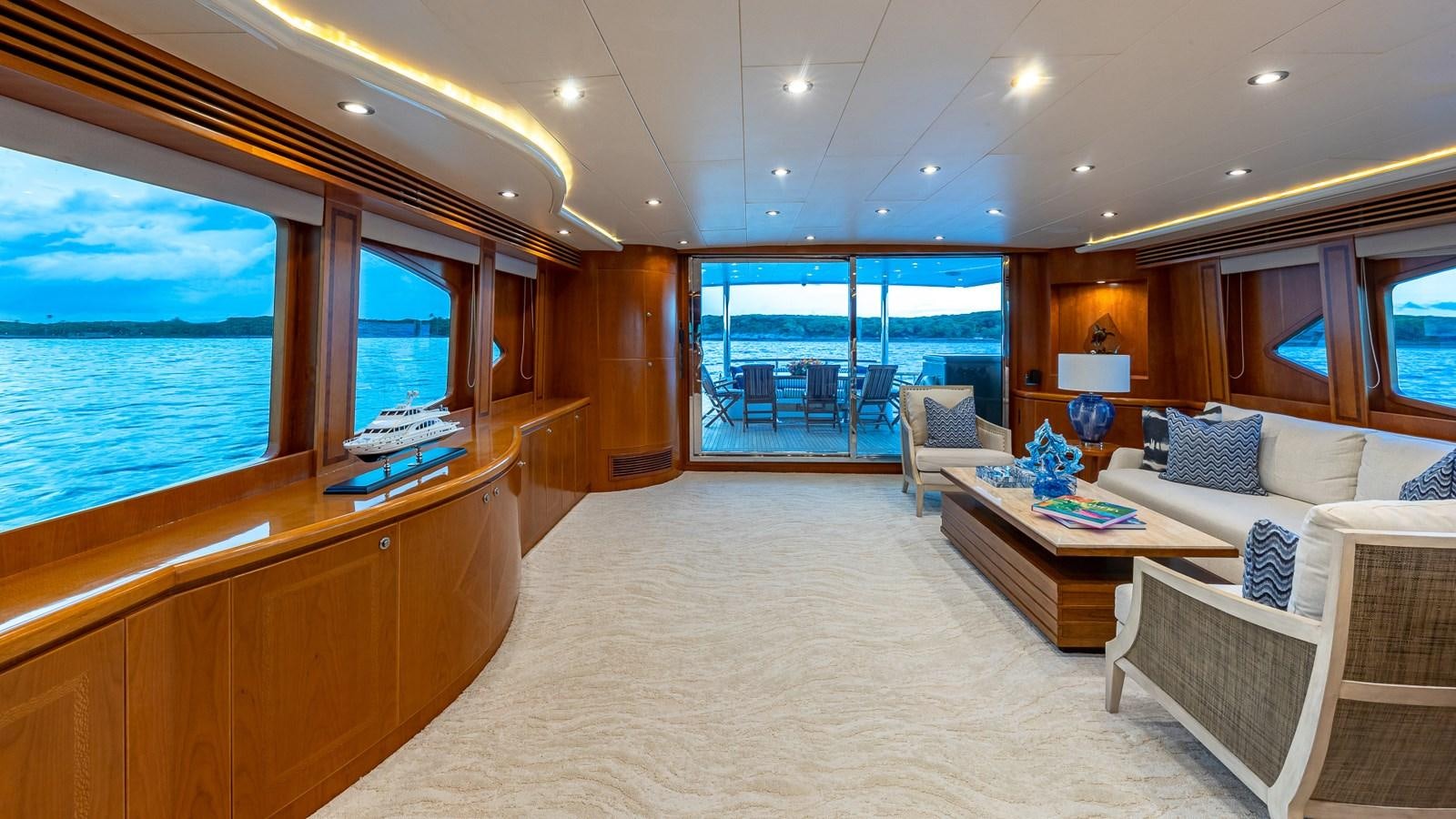 a room with a couch and a table and a window aboard B HAPPY Yacht for Sale