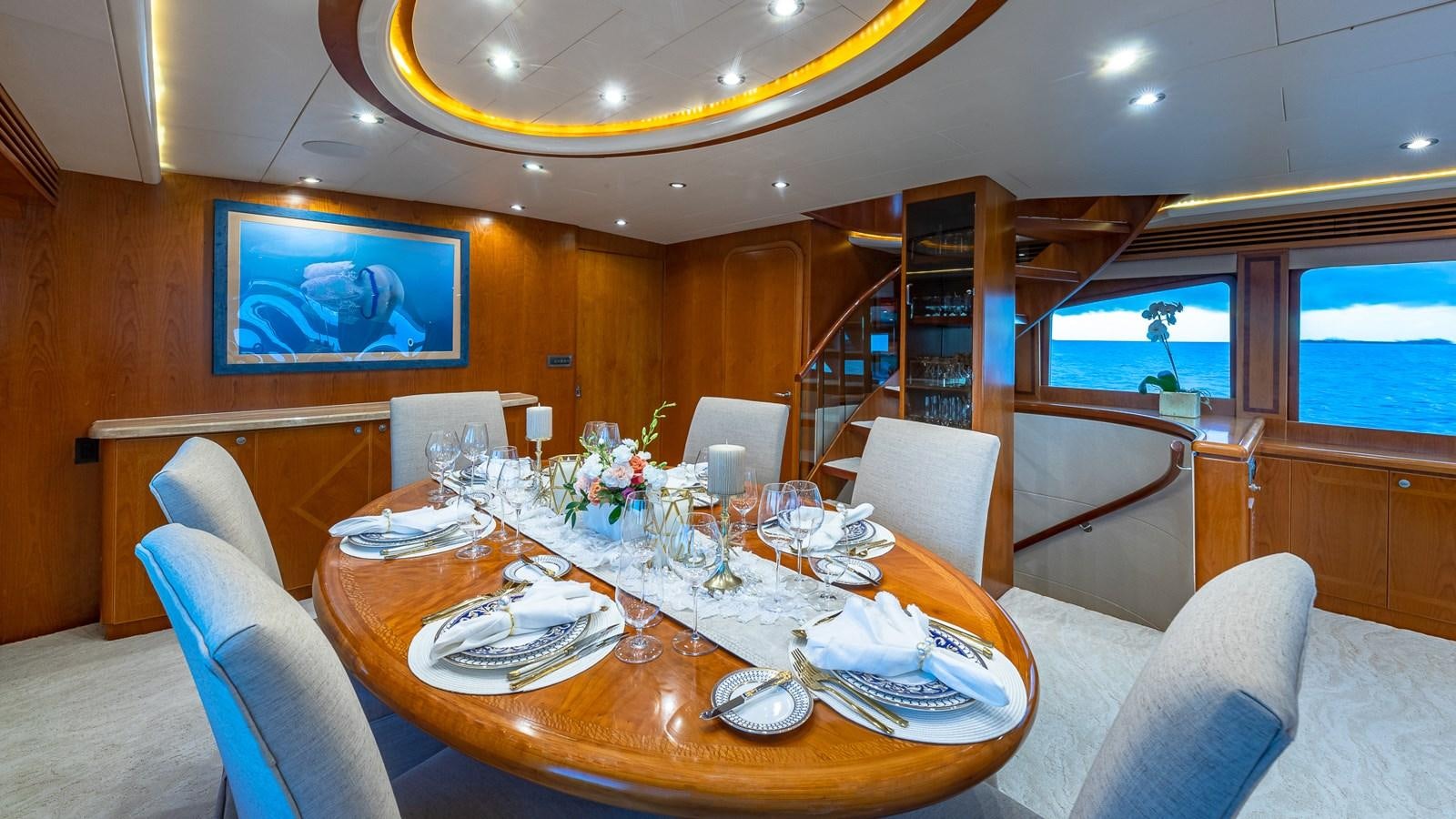 a dining table in a cabin aboard B HAPPY Yacht for Sale